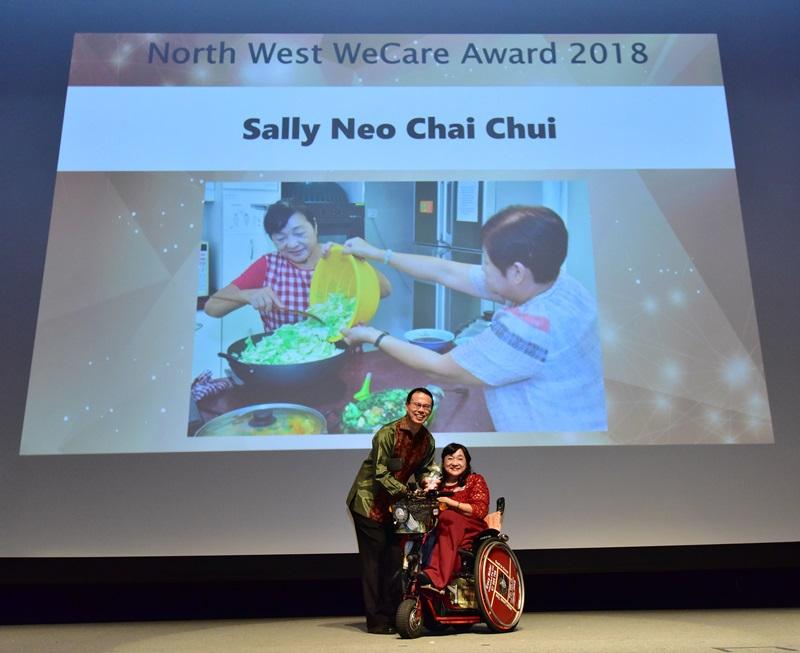 sally_neo_receiving_award_on_stage_Medium.jpg