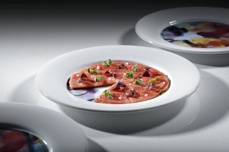 人气招牌金枪鱼比萨。（餐馆提供）