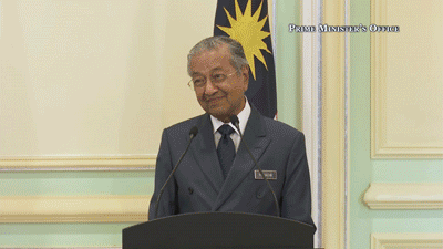 Mahathir gazes at PM Lee Hsien Loong with approval