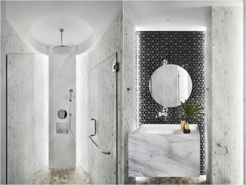 设计师选用黑白、象牙色的菱形与六角图形瓷砖，搭配白色大理石洗手台，打造华美而不浮夸，高级水疗中心的效果。