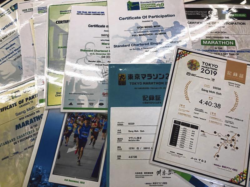 吴成茂在过去11年跑了14场全马。(受访者提供)