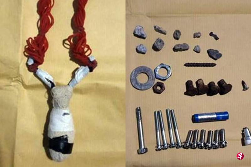 左图:警方起获的土制弹弓造型简单,相信是由晾衣叉和多条塑胶圈组合而成。右图: 螺栓螺母当‘弹丸’ 除了螺栓和螺母之外,落网男子相信也把小石子和电池当成“弹丸”来使用。(警方提供) 左图:警方起获的土制弹弓造型简单,相信是由晾衣叉和多条塑胶圈组合而成。右图: 螺栓螺母当‘弹丸’ 除了螺栓和螺母之外,落网男子相信也把小石子和电池当成“弹丸”来使用。(警方提供)