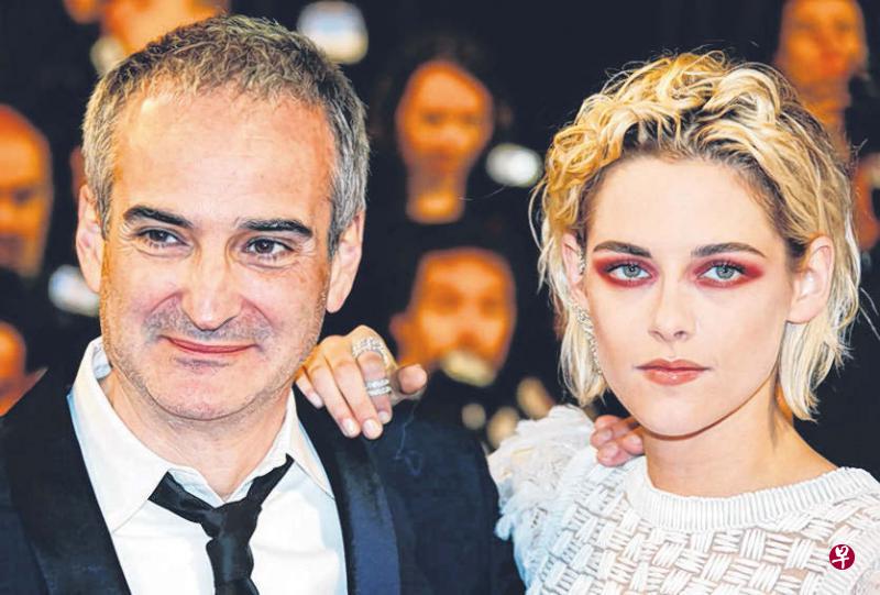 克里斯汀(右)与阿萨亚斯17日现身康城。(路透社) 克里斯汀(右)与阿萨亚斯17日现身康城。(路透社)