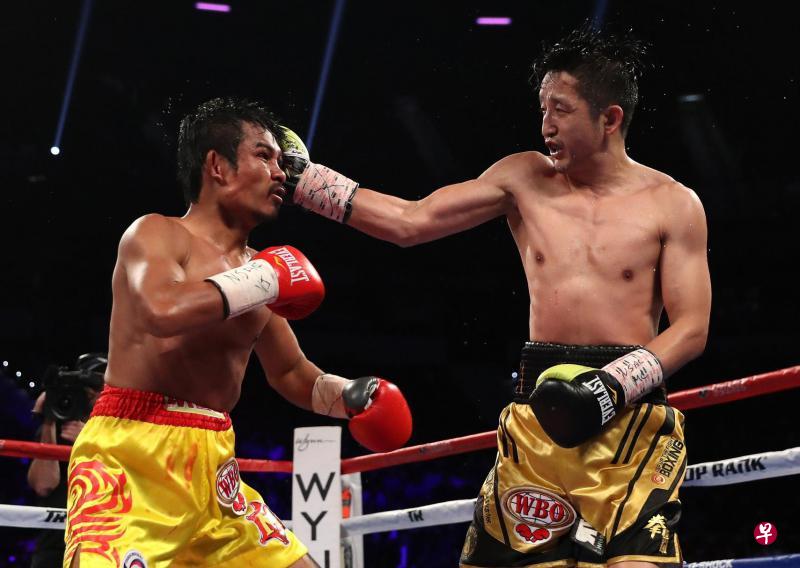 邹市明(右)凭借身高优势,一拳打中帕波姆头部。(法新社) 邹市明(右)凭借身高优势,一拳打中帕波姆头部。(法新社)