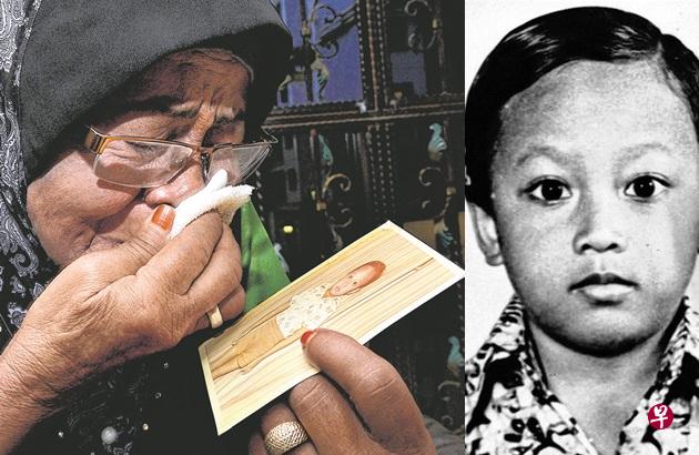 看着卡惹里的照片,母亲达利亚再次崩溃痛哭。(新报) 看着卡惹里的照片,母亲达利亚再次崩溃痛哭。(新报)