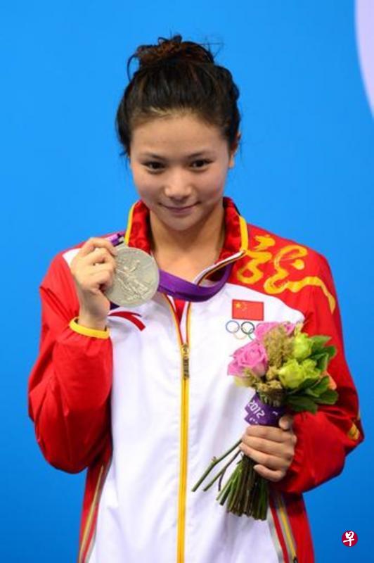 2012年奥运,何姿夺得女子双人3米跳板金牌。(法新社) 2012年奥运,何姿夺得女子双人3米跳板金牌。(法新社)