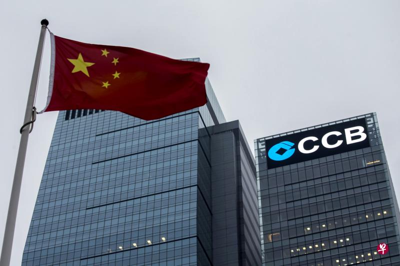 A Chinese national flag flies in front of the China Construction Bank (CCB) Tower at Hong Kong's Central business district December 26, 2014. FILE PHOTO: REUTERS A Chinese national flag flies in front of the China Construction Bank (CCB) Tower at Hong Kong's Central business district December 26, 2014. FILE PHOTO: REUTERS