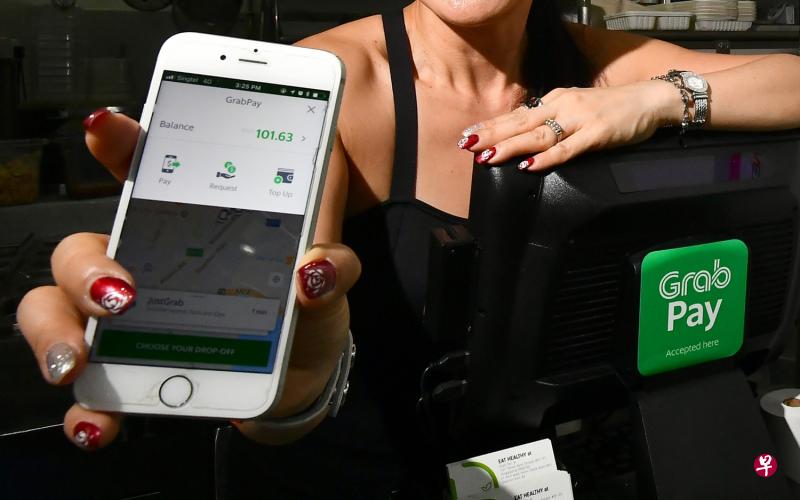 游客来新加坡游玩时,可选用GrabPay付费。(档案照) 游客来新加坡游玩时,可选用GrabPay付费。(档案照)