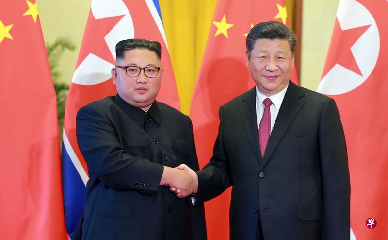 6月19日,金正恩与习近平在北京会晤。(法新社) 6月19日,金正恩与习近平在北京会晤。(法新社)