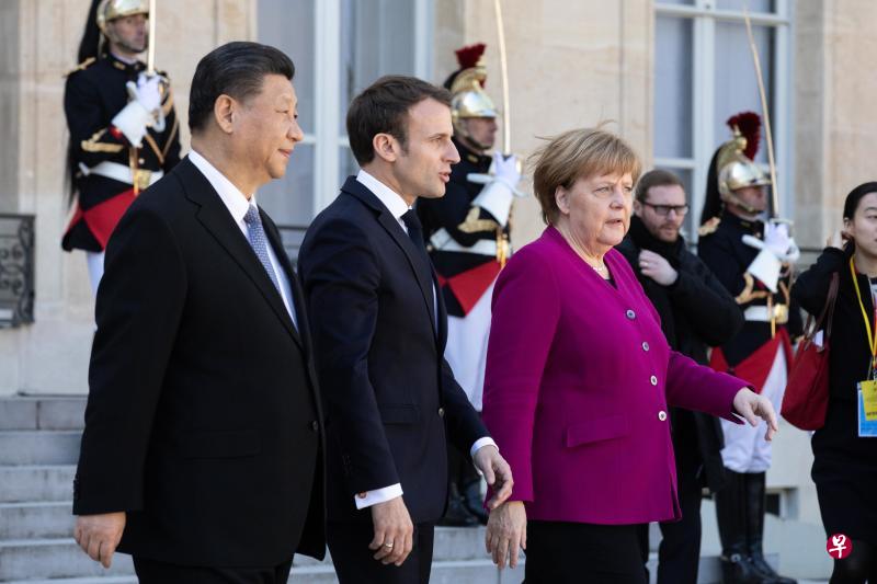 中国国家主席习近平(左)早前与法国总统马克龙(中)和德国总理默克尔在巴黎会面。(彭博社) 中国国家主席习近平(左)早前与法国总统马克龙(中)和德国总理默克尔在巴黎会面。(彭博社)