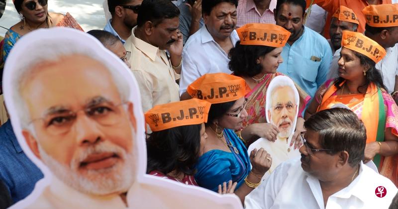 印度总理莫迪领导的执政党人民党确定在大选中赢得压倒性胜利,莫迪笃定连任,可继续执政五年。(法新社) 印度总理莫迪领导的执政党人民党确定在大选中赢得压倒性胜利,莫迪笃定连任,可继续执政五年。(法新社)