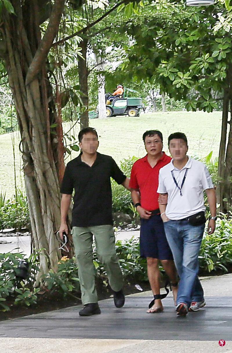 被告邱桂福(穿红衣者)今早被判终身监禁。(档案照) 被告邱桂福(穿红衣者)今早被判终身监禁。(档案照)