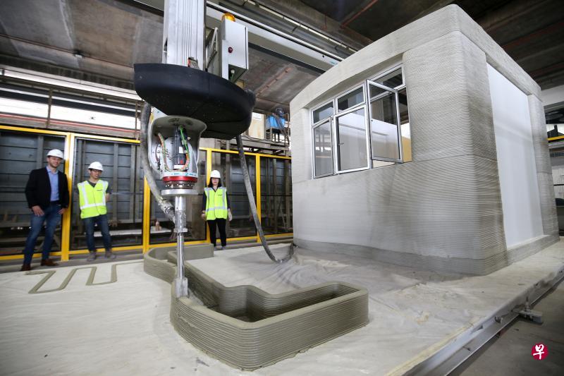 利用3D打印机建房更快捷,而且打印机可以打印出各种形状,让建筑设计拥有更多可能性。(叶振忠摄) 利用3D打印机建房更快捷,而且打印机可以打印出各种形状,让建筑设计拥有更多可能性。(叶振忠摄)