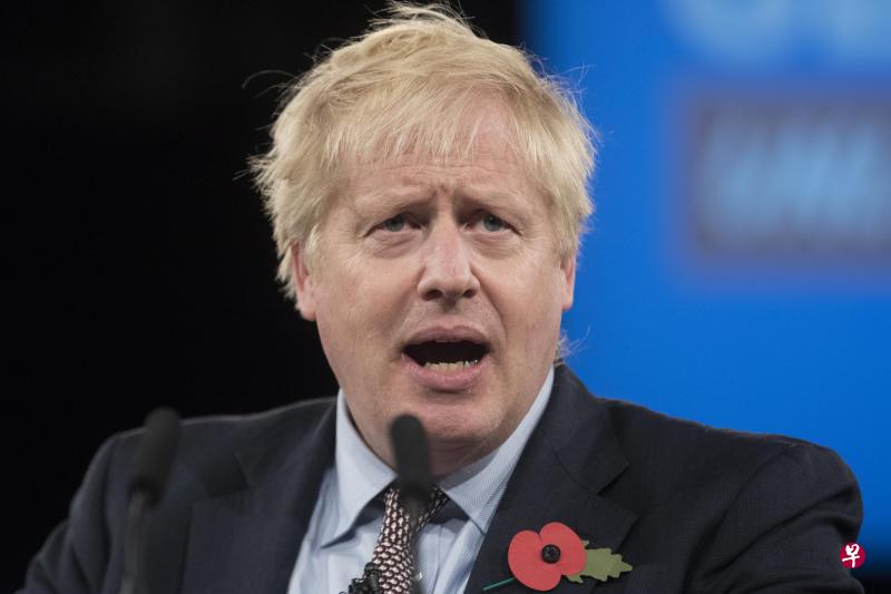 约翰逊敦促英国选民协助他领导的保守党赢得国会多数议席,称只要赢得多数议席,他就能让国会恢复运转。(彭博社) 约翰逊敦促英国选民协助他领导的保守党赢得国会多数议席,称只要赢得多数议席,他就能让国会恢复运转。(彭博社)
