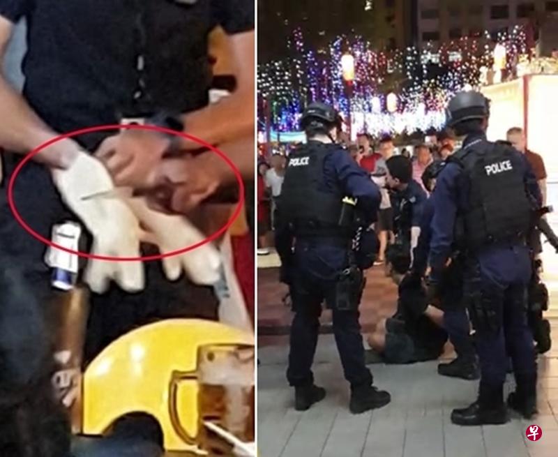 文身男坐在地上后,双手被上铐。(读者提供) 文身男坐在地上后,双手被上铐。(读者提供)