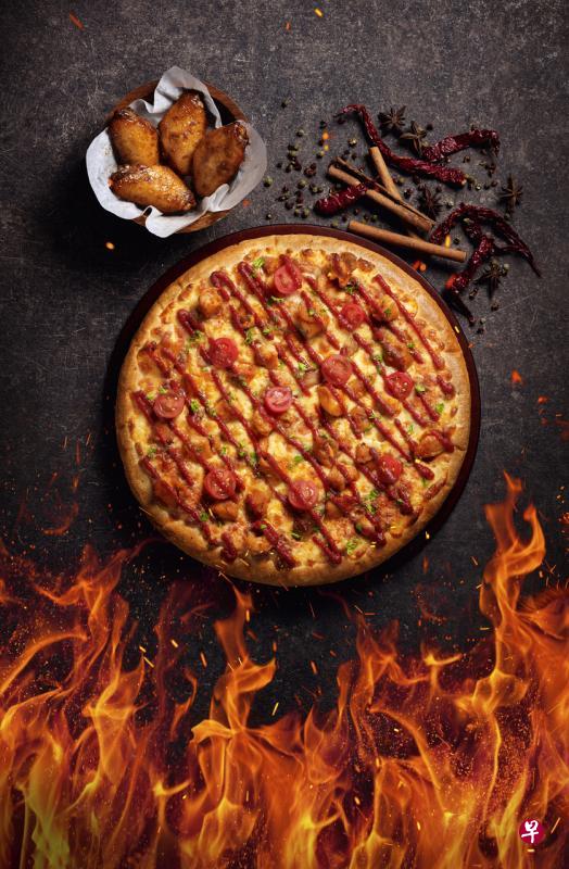 Pizza Hut限时推出麻辣比萨和麻辣鸡翅。(餐馆提供) Pizza Hut限时推出麻辣比萨和麻辣鸡翅。(餐馆提供)