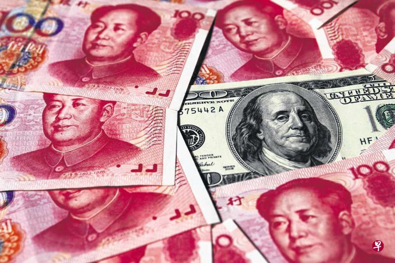 离岸人民币兑美元汇率昨天早盘走高,一度达到6.9966元,为3月17日以来最高。(路透社) 离岸人民币兑美元汇率昨天早盘走高,一度达到6.9966元,为3月17日以来最高。(路透社)