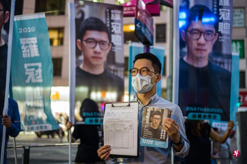 有消息称,香港警方正通缉六名逃往海外的政治人物,包括香港众志前常委罗冠聪。(法新社档案照片) 有消息称,香港警方正通缉六名逃往海外的政治人物,包括香港众志前常委罗冠聪。(法新社档案照片)