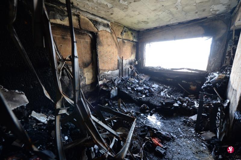 缅甸籍女佣熨衣服后忘记关电,结果引发大火,整个单位几近烧毁,窗户也被烧至脱落。(潘丰源摄) 缅甸籍女佣熨衣服后忘记关电,结果引发大火,整个单位几近烧毁,窗户也被烧至脱落。(潘丰源摄)