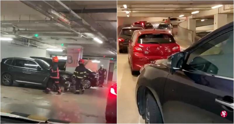多辆汽车在停车场受困近一小时,有车主拨电通知民防和警方到场。(读者提供) 多辆汽车在停车场受困近一小时,有车主拨电通知民防和警方到场。(读者提供)