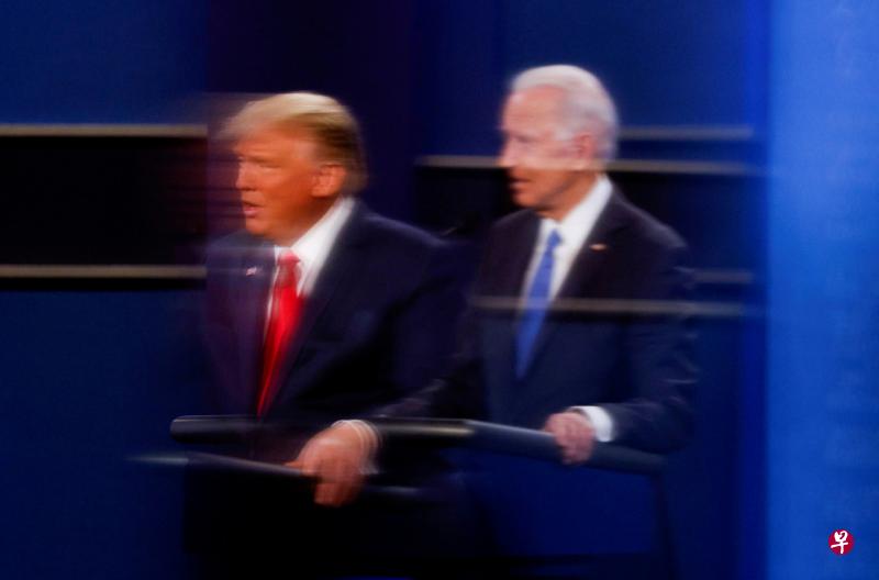 如果民调正确,拜登(右)将轻松获胜,但特朗普也有可能意外获胜。(路透社) 如果民调正确,拜登(右)将轻松获胜,但特朗普也有可能意外获胜。(路透社)