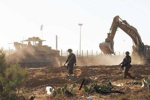 以色列军方发布的照片显示，5月8日，以军士兵在加沙地带南端城市拉法作战。（法新社）
